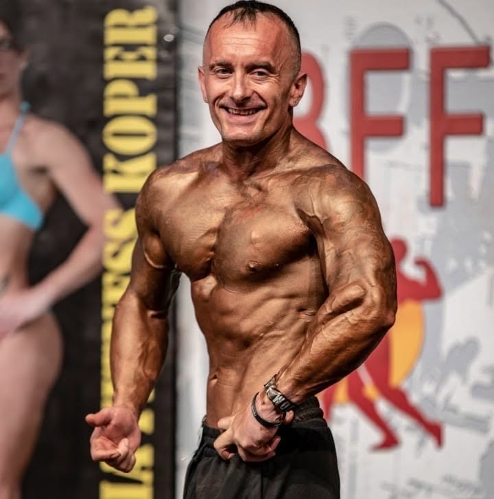 Club athlete on stage at an IBFF competition